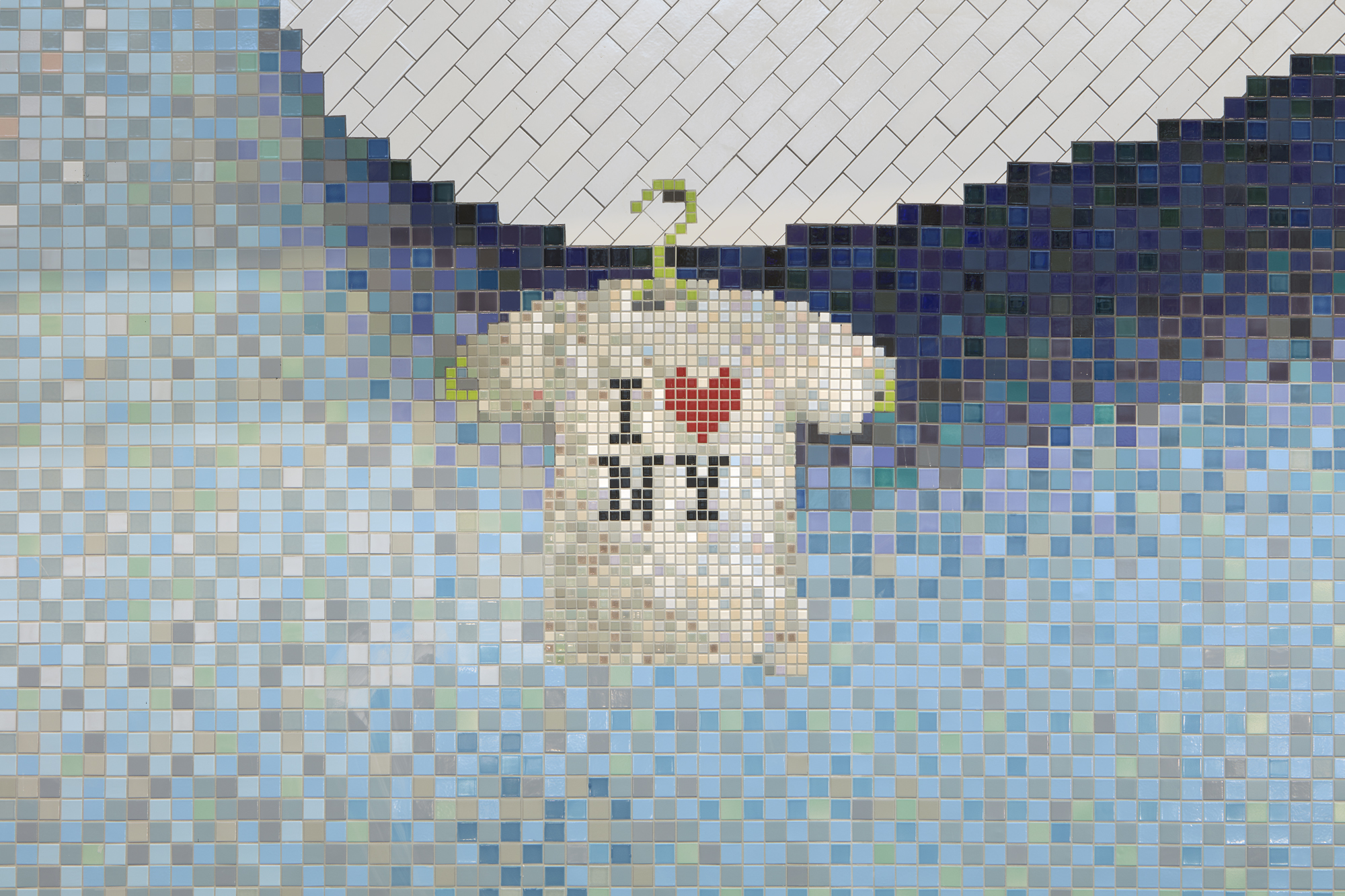 A tiled mosaic of a white i heart ny t-shirt floating against a light blue background with the edge of a large cloud on the top left.